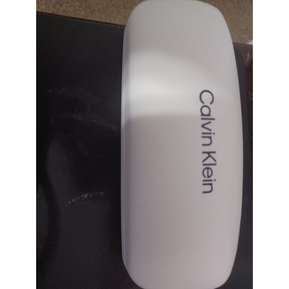 Calvin Klein White Clam Shell Case Blk felt Interior With Calvin Klein Eyeglass